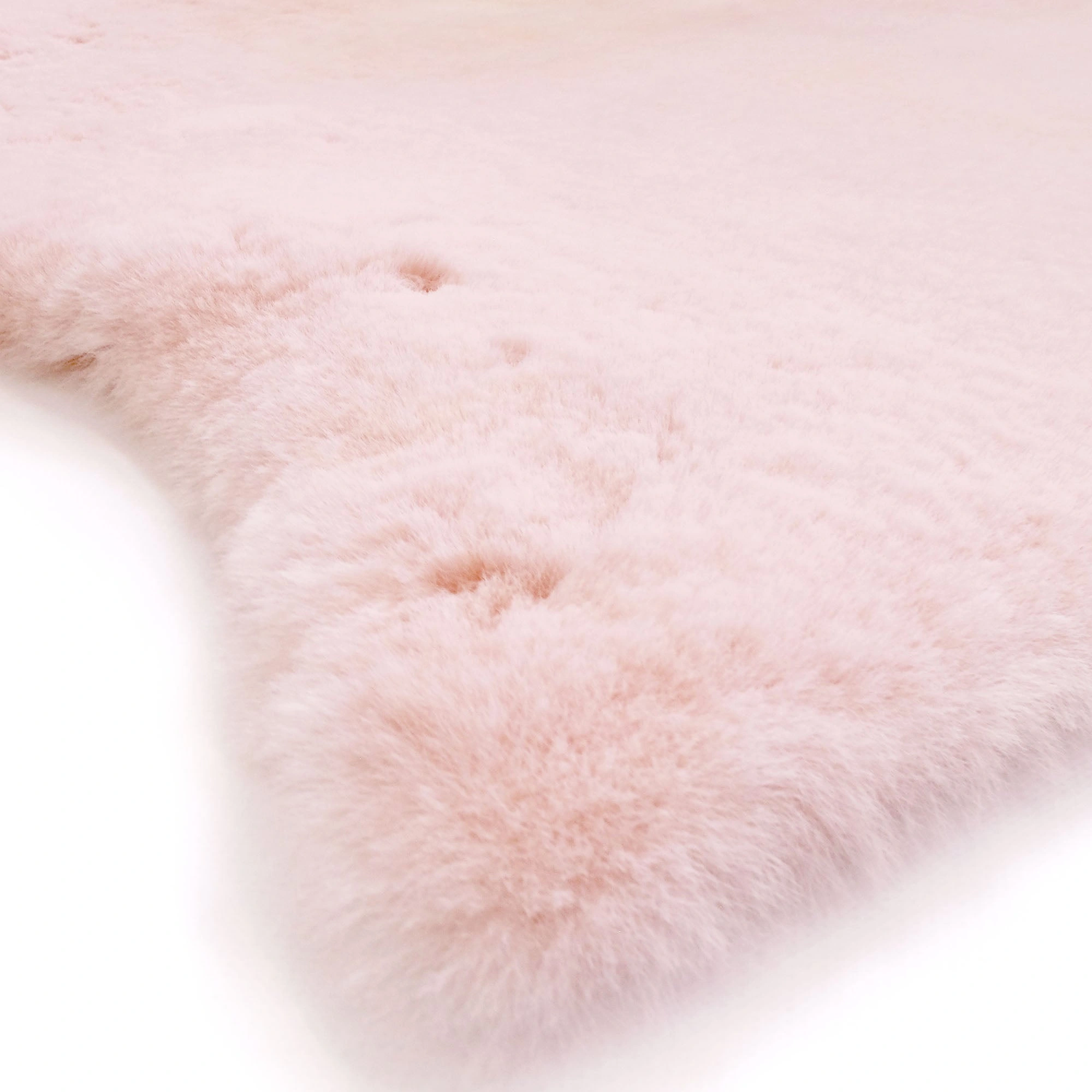 Luxurious Pink Baby Lambskin Rug – Soft Australian Merino Wool Comfort.